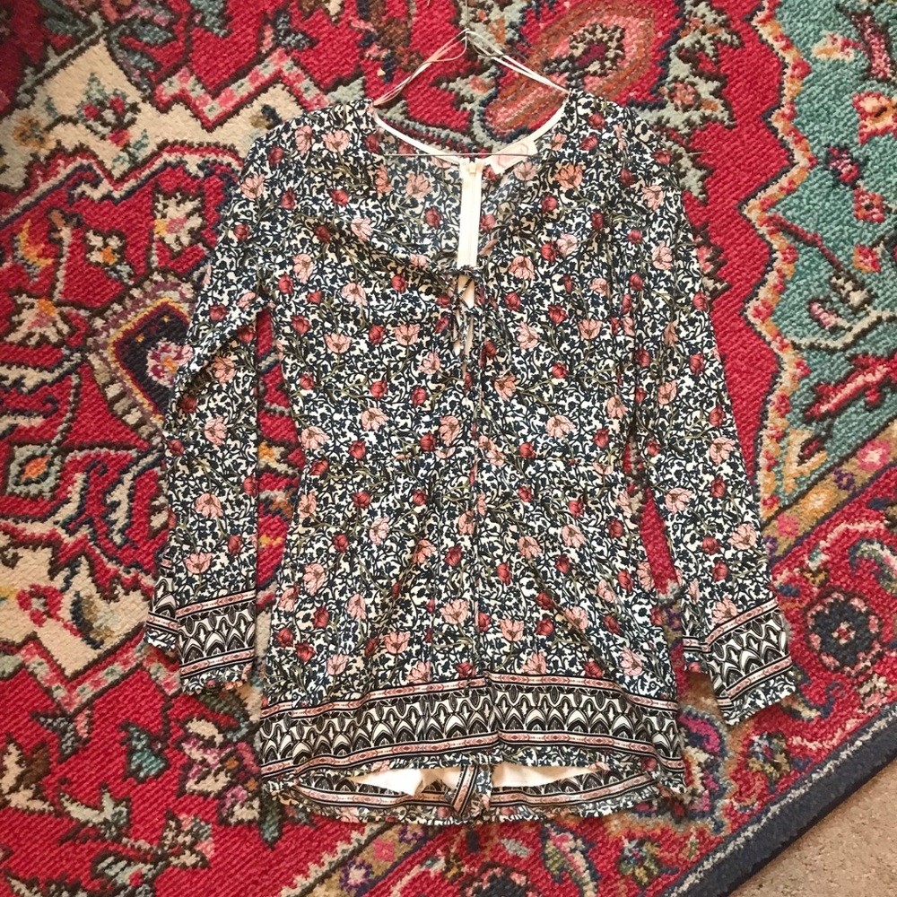 Floral boutique romper with lace up detail